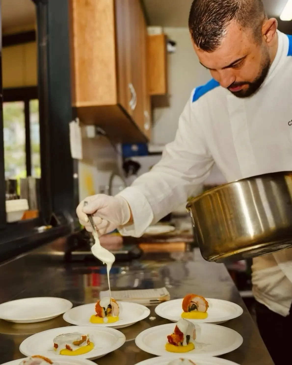 Chef Slaveyko Slaveykov preparing gourmet food in the kitchen